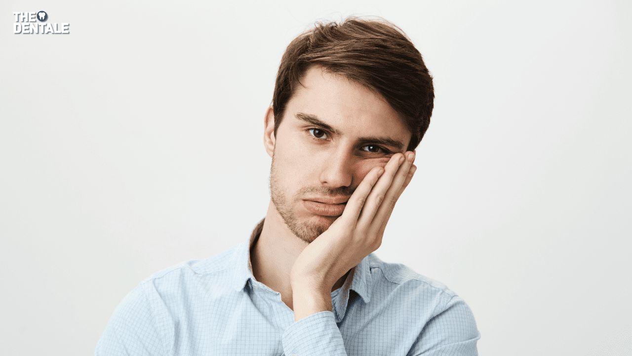 A man placing his hand on jaw in jaw pain. A man holding his jaw in pain. Worried about a wisdom teeth removal infection? Learn the warning signs, causes, treatment options, and best recovery tips to prevent dangers...